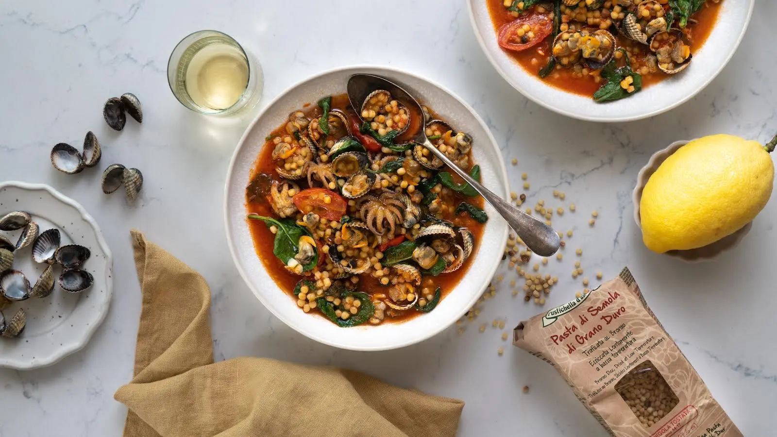 Fregola alle Vongole und Moscardini